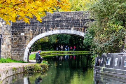 man fishing in canal in horsforth