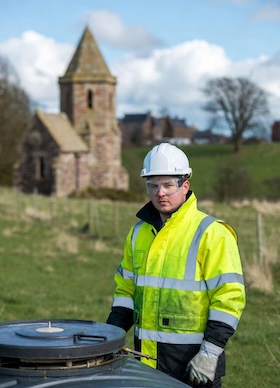 drainage engineer emptying a septic tank